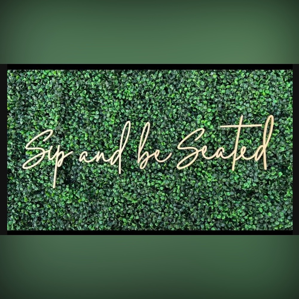 Sip and be seated sign